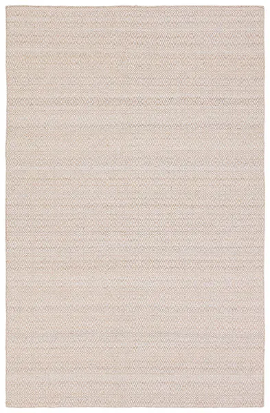 Handwoven outdoor rug with diamond trellis pattern in tan and cream featuring a subtle distressed look