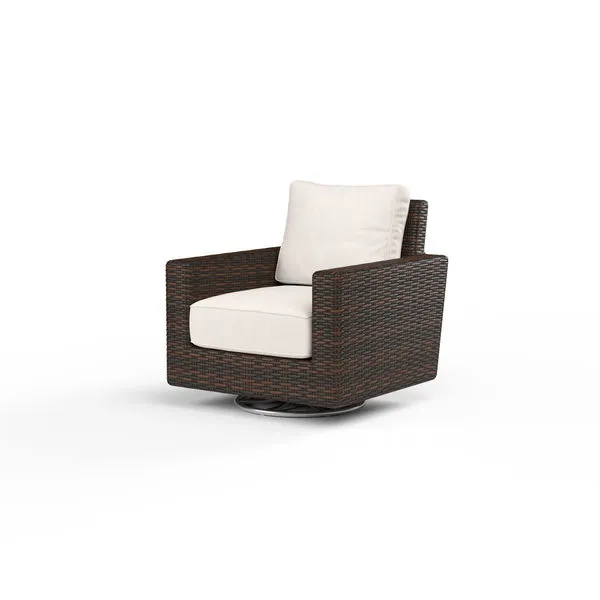 Montecito Swivel Rocker Club Chair with rich Cognac multi-colored resin wicker and cream cushions