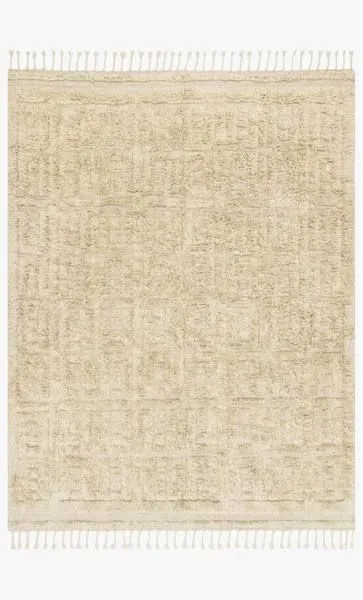 Neutral oatmeal shag rug with subtle geometric patterns and fringed edges, hand knotted wool texture
