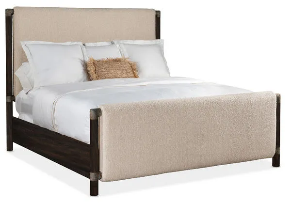 Queen-sized upholstered panel bed with beige textured fabric headboard and footboard and dark wood frame accents