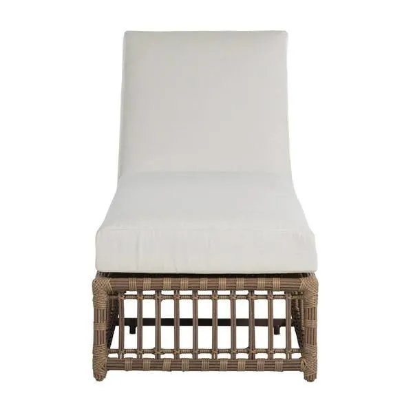 Newport Onyx Woven Chaise with light beige cushioned seat and back on a natural brown woven base