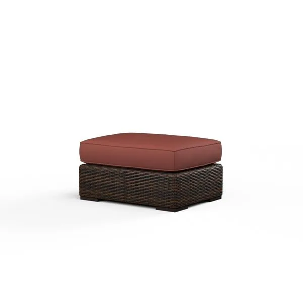 Montecito Ottoman with dark multi-colored resin wicker base and thick cushioned seat in burnt orange color