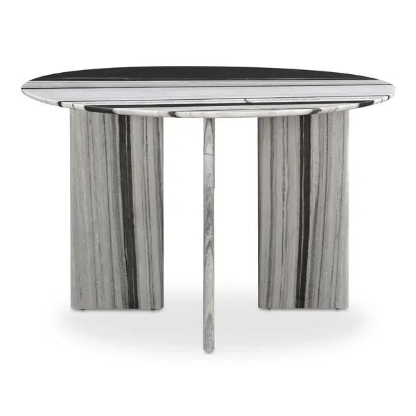 Celia round dining table with white panda marble top and geometric marble base featuring vertical gray and black stripes