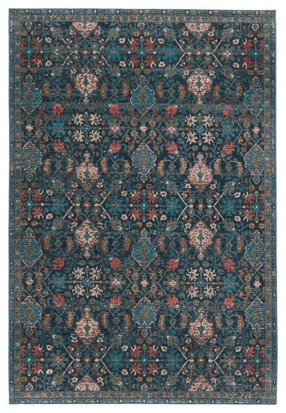 Indoor/outdoor area rug with dark blue background and multicolor whimsical floral trellis pattern