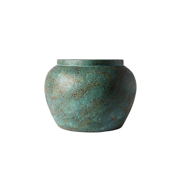 Round turquoise jar with a mottled textured surface in blue and brown hues, wide body, narrow flat rim