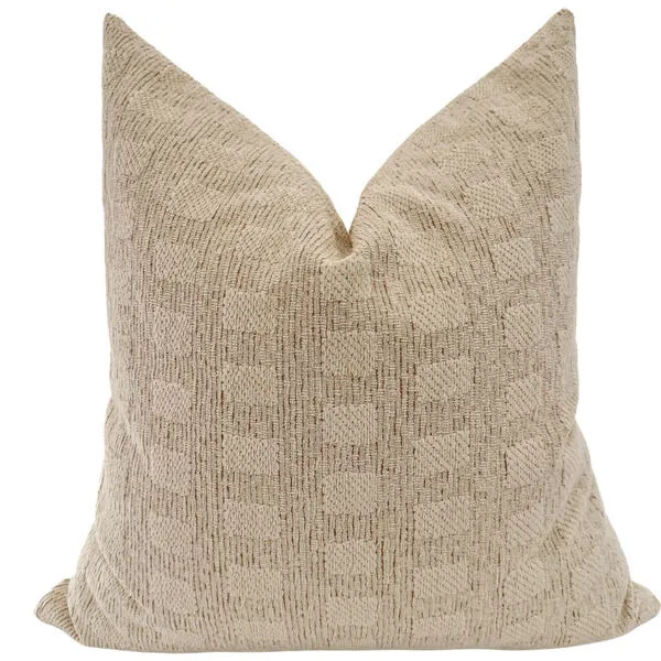 Creamy pillow cover in soft beige fabric with a subtle textured checkered pattern and plush fill