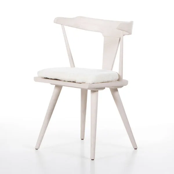 Off-white Ripley Dining Chair in sculptural oak silhouette with sheared sheepskin loose seat cushion