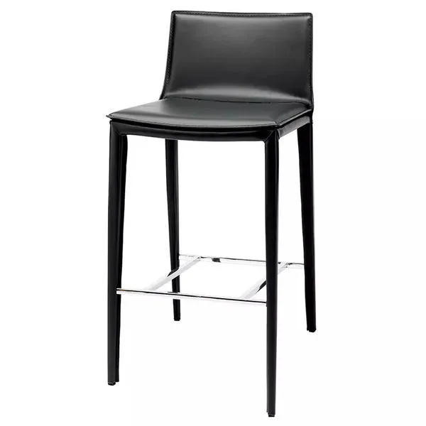 Three-quarter view showing sleek upholstery and chrome footrest of Palma Bar Stool