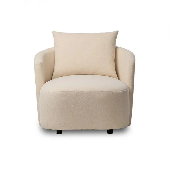 Farrah Chaise Lounge in beige with pill-shaped cushioned seat, sculpted arms, and matching loose pillow