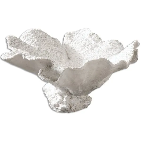 Side view of white textured bowl showing outer matte finish and detailed irregular edges with sculptural base