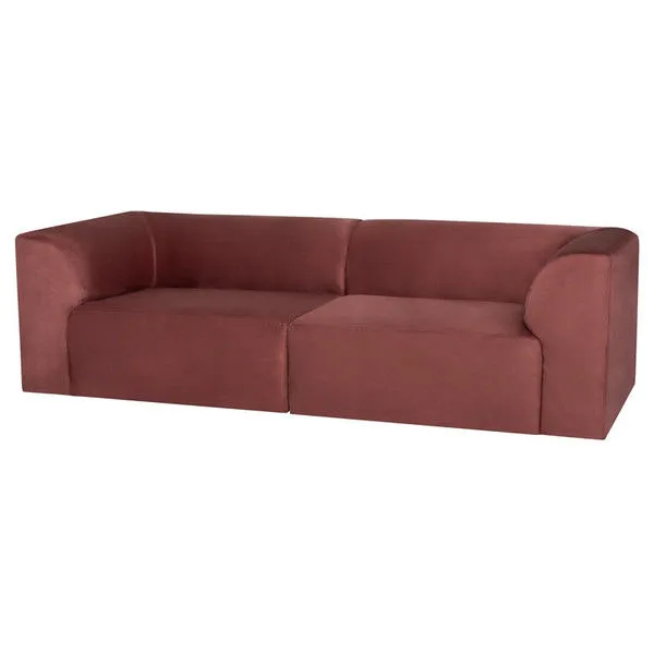 Isla Sofa in muted rusty red fabric with modern, minimalist design, gently arched back, and boxy base.