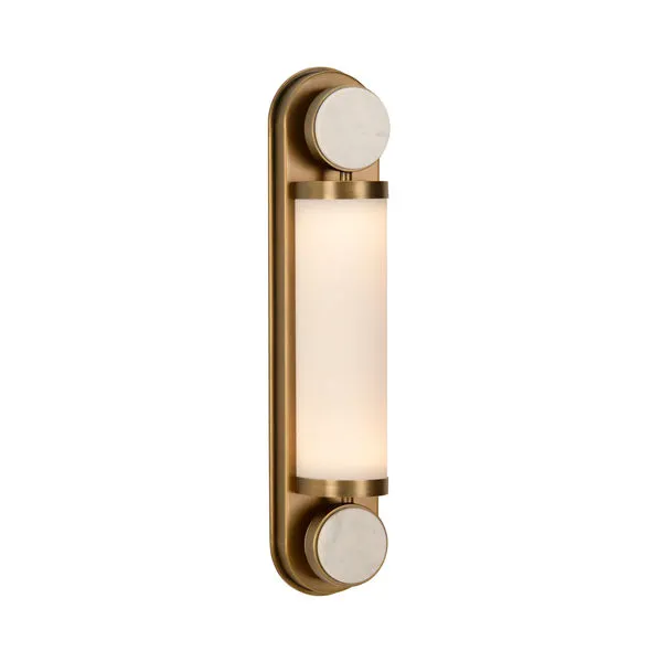 Emmons Sconce with warm brass finish, cylindrical frosted glass light, and honed Carrera marble accents top and bottom