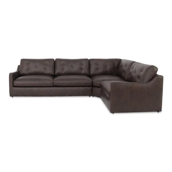 Three-piece brown leather sectional sofa with tufted back cushions and sloped arms in a right-handed configuration