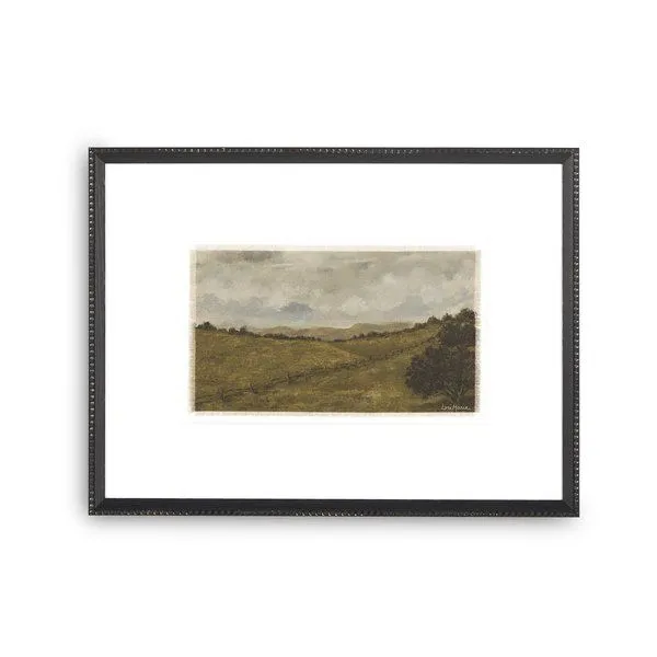 Framed landscape painting with rolling hills, a fence line, cloudy sky, and dark tree clusters