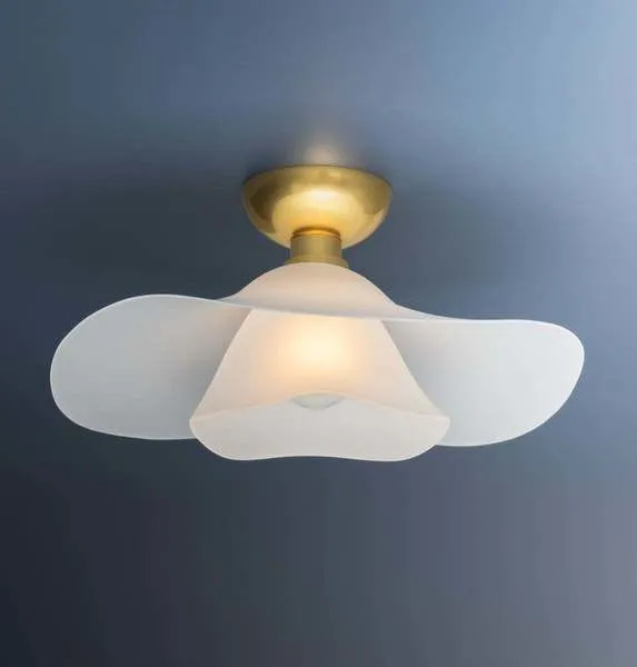 Netherlee Flush Mount ceiling light with two shallow frosted glass shades forming a flowing floral silhouette and aged bra...