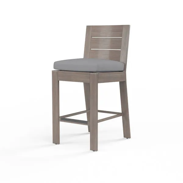 Laguna Counter Stool with hand-brushed gray aluminum frame mimicking driftwood and gray cushioned plank seat and back