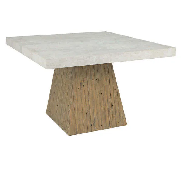 Square dining table with a concrete laminate top and a tapered reclaimed pine wood plinth base