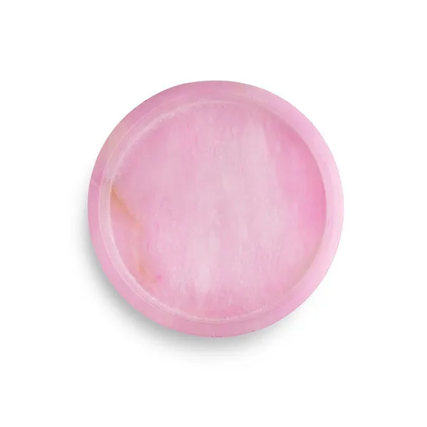 Round tray with soft pink alabaster stone featuring smooth polished surface and natural veining