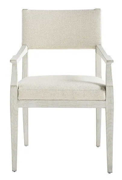 Ridge Dining Arm Chair with light wood frame and beige upholstered seat and back, featuring clean, structured arms
