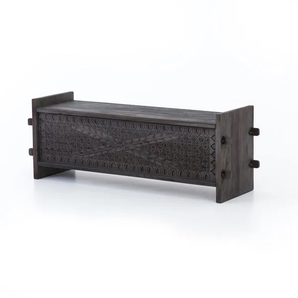 Columbus Trunk in dark wood with geometric carved front panel and sturdy side pegs