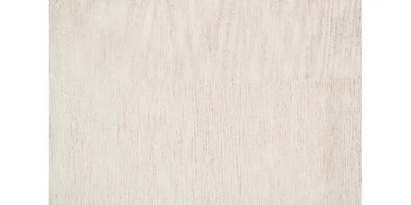 Serena Ivory Rug in a soft ivory shade with subtle variegated texture from hand-knotted cotton, rayon, and polyester fibers.
