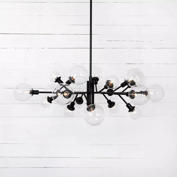 Matte black iron chandelier with multiple sculptural arms and clear glass bulbs in cluster design