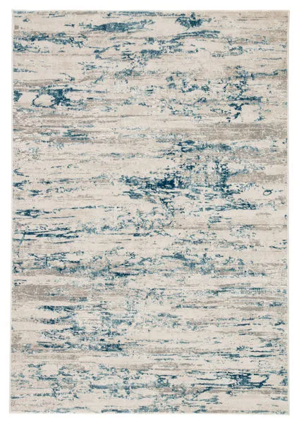 Abstract ivory rug with distressed mottled blue and gray pattern, modern Cirque collection