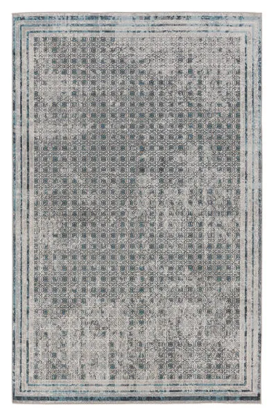 Rectangular light gray area rug with distressed blue trellis pattern and subtle gold and cream accents