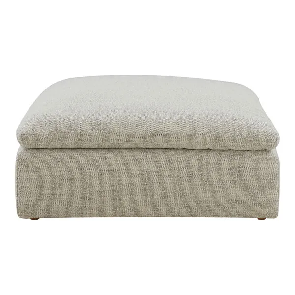 Square Clay ottoman in light beige fabric with thick cushioned top and low, boxy base