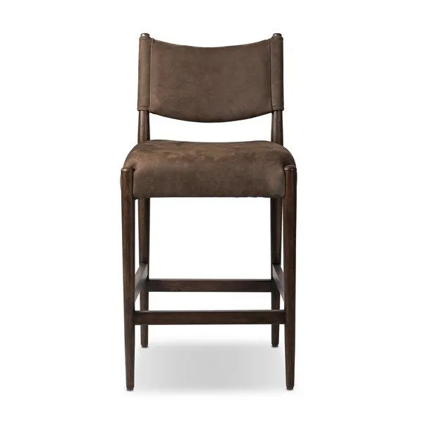 Jayla counter stool with midcentury design features, dark brown leather cushions, and dark wood frame, shown from front