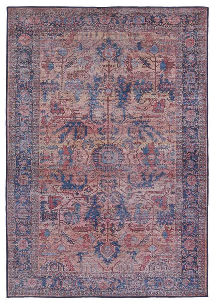 Distressed medallion rug with floral motifs in green, blue, blush, rose, and beige tones, vintage-inspired design