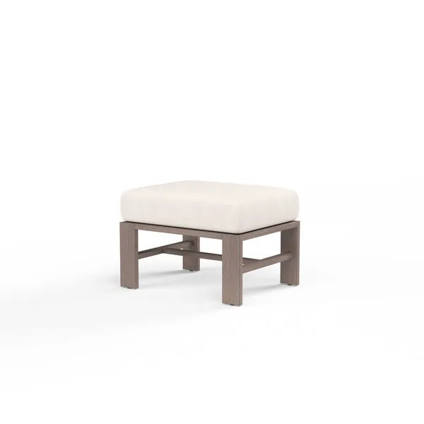 Laguna Ottoman with aluminum frame in hand-brushed driftwood finish and thick white cushion top