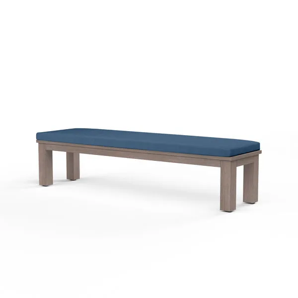 Laguna Dining Bench with hand-brushed driftwood finish aluminum frame and deep blue cushioned top