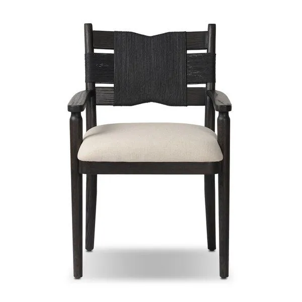 Tova Dining Armchair with black wood frame, sculptural rope-wrapped back, and neutral cushioned seat