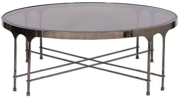 Round Calliope Cocktail Table with curved apron and cross-base metal frame with a dark glass top and metallic finish