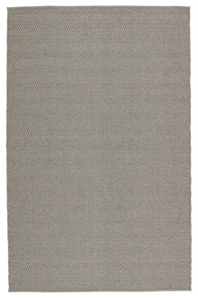 Handwoven indoor/outdoor gray rug with textured striped pattern in solid muted gray hue