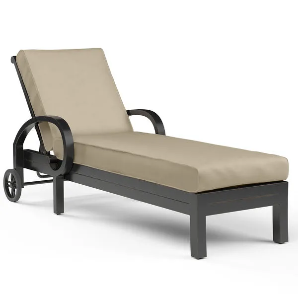 Monterey Chaise Lounge with curved arms, padded beige cushion, dark espresso aluminum frame, and old world copper rub finish