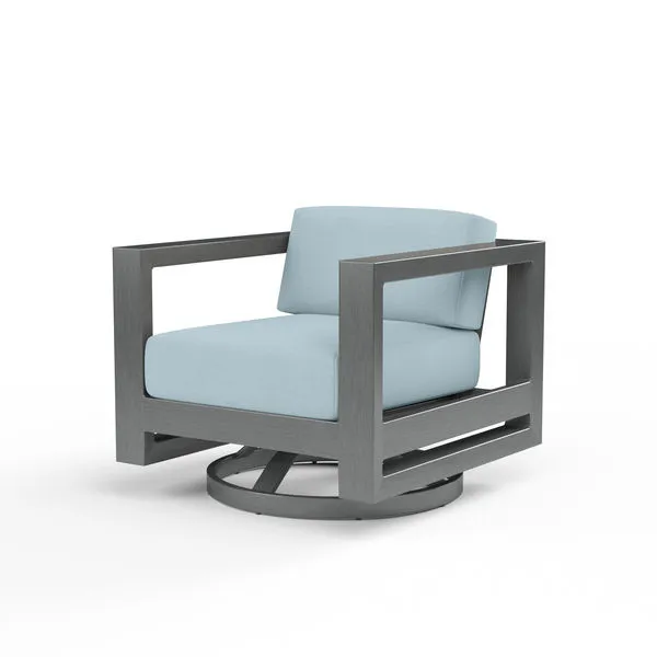Mid-century inspired swivel outdoor club chair with low back, linear Slate-finished aluminum frame and light blue cushions