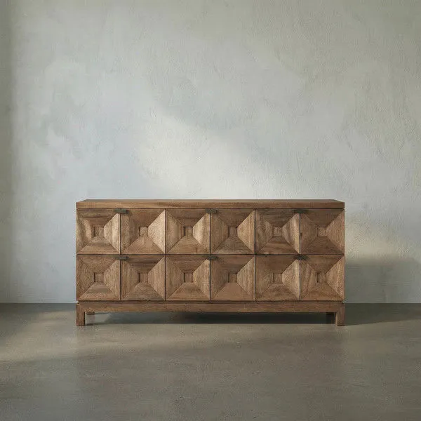 Dark walnut 6-drawer console table with faceted pyramidal drawer fronts and minimal brass pulls on a defined base