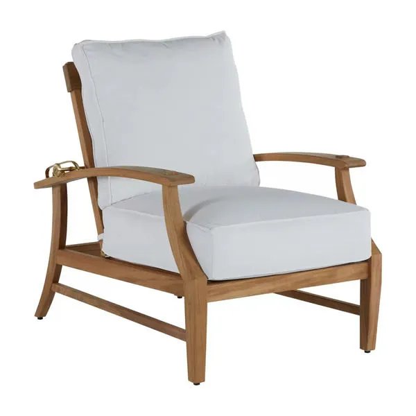 Croquet teak recliner chair with white cushions and curved armrests in a light wood finish
