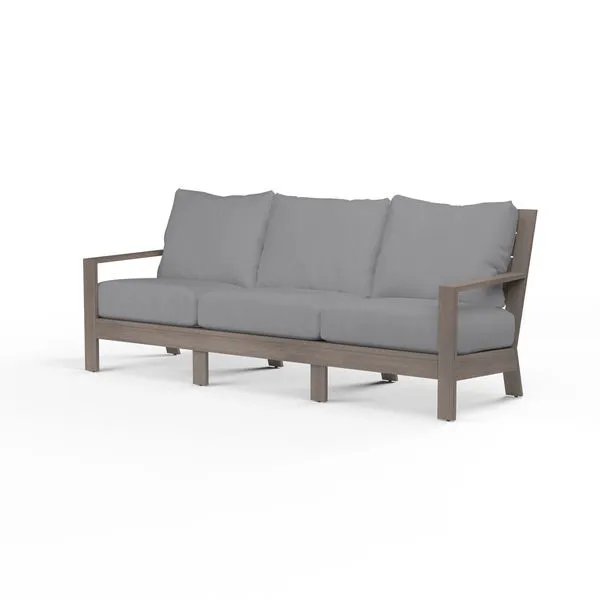 Laguna Sofa with hand-brushed aluminum frame mimicking driftwood and grey seat cushions