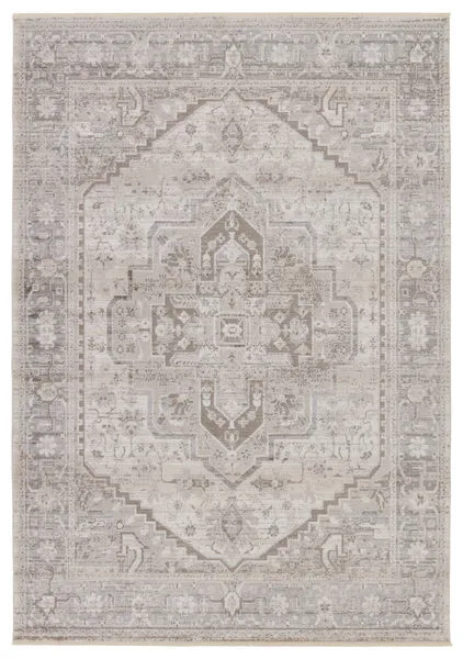 Traditional rug with ornate center medallion in taupe, silver, and cream hues, featuring vintage-inspired patterns