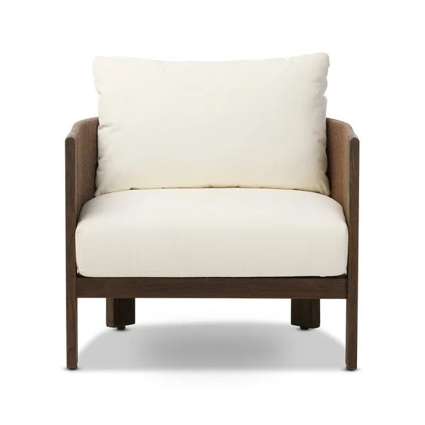 Barrel-backed outdoor chair with simple shaping and linear woven cording finish in brown with white cushions