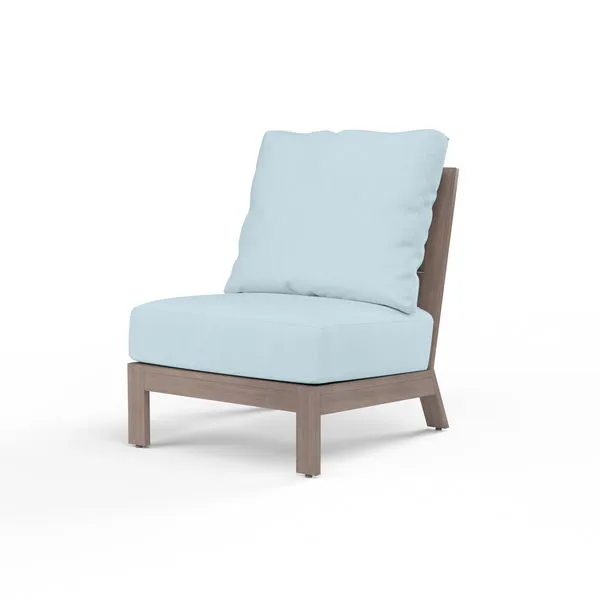 Laguna Armless Club outdoor accent chair with driftwood-tone aluminum frame and light blue cushions