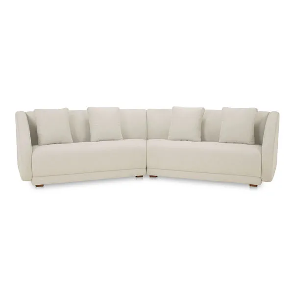 Cream-colored Fraser 2 Piece Modular Sofa with curved armrests, plush cushions, and minimalist wooden base