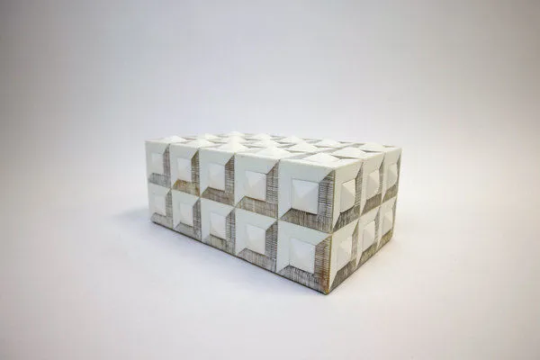 Small rectangular storage box with raised cubed bone inlaid pattern in white and beige tones