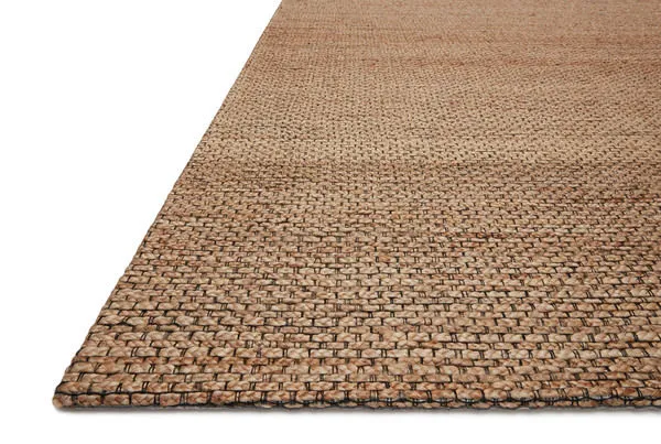 Side-angle view showing rug’s flat weave and slightly raised edge on a white background
