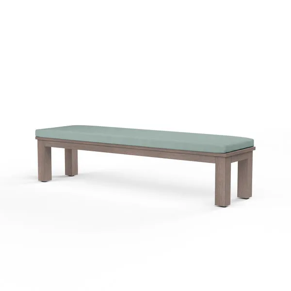 Laguna Dining Bench with hand-brushed driftwood finish and tailored light blue cushion on a rectangular aluminum frame