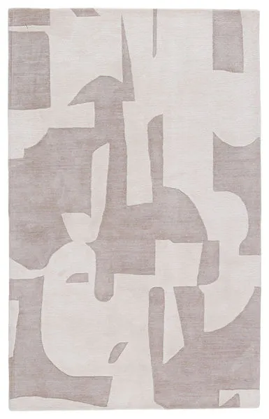 Hand-tufted area rug with abstract taupe and cream geometric shapes and subtle sheen