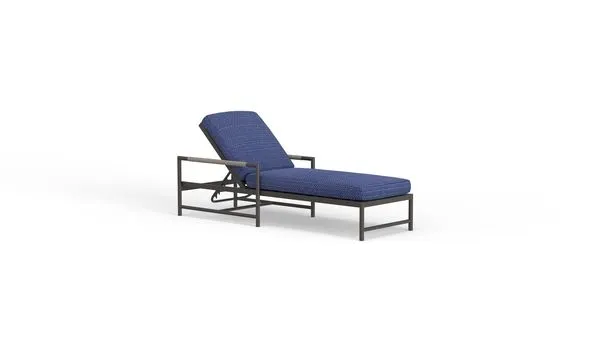 Pietra Chaise in matte Graphite aluminum frame with adjustable back and plush blue cushions